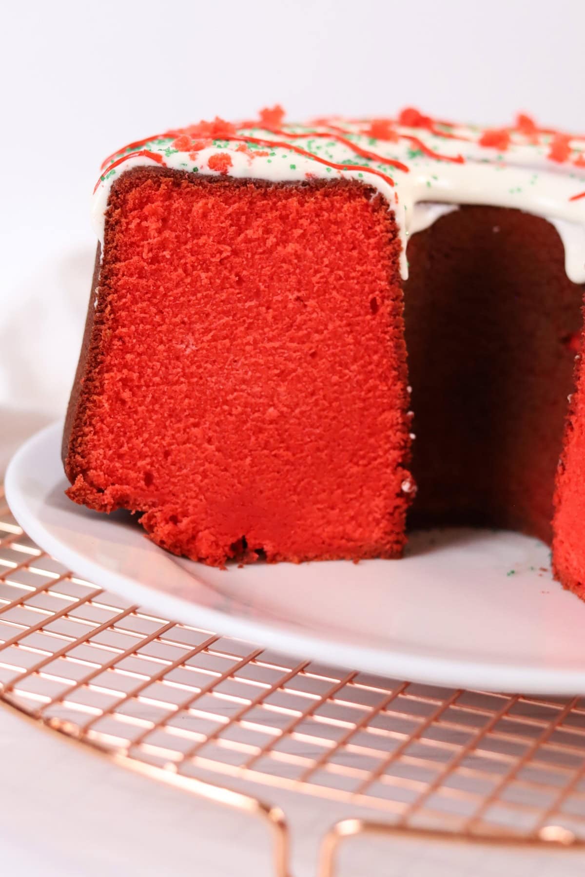 Tangy and moist red velvet cake with creamy frosting, perfect for celebrations.