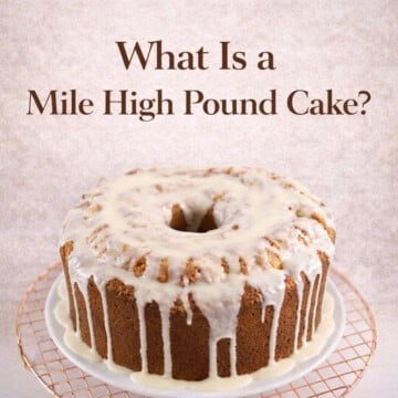 Delicious mile-high layered cake topped with creamy icing and drizzle, perfect for celebrations.